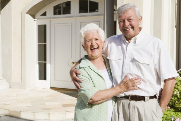 Smiling caucasian elderly female and male